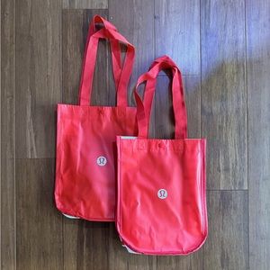 2 red lululemon shopping bags small